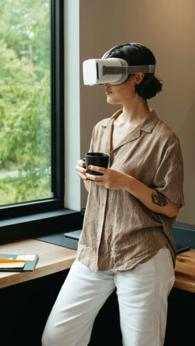 Girl Wearing VR Headset Holding Black Coffee Cup 4K Ultra HD Mobile Wallpaper