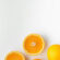 Clean Whole and Half Oranges White Background 4K Ultra HD Mobile Phone Wallpaper