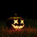 Glowing Halloween Pumpkin Decoration On Grass 4K Ultra HD Mobile Phone Wallpaper