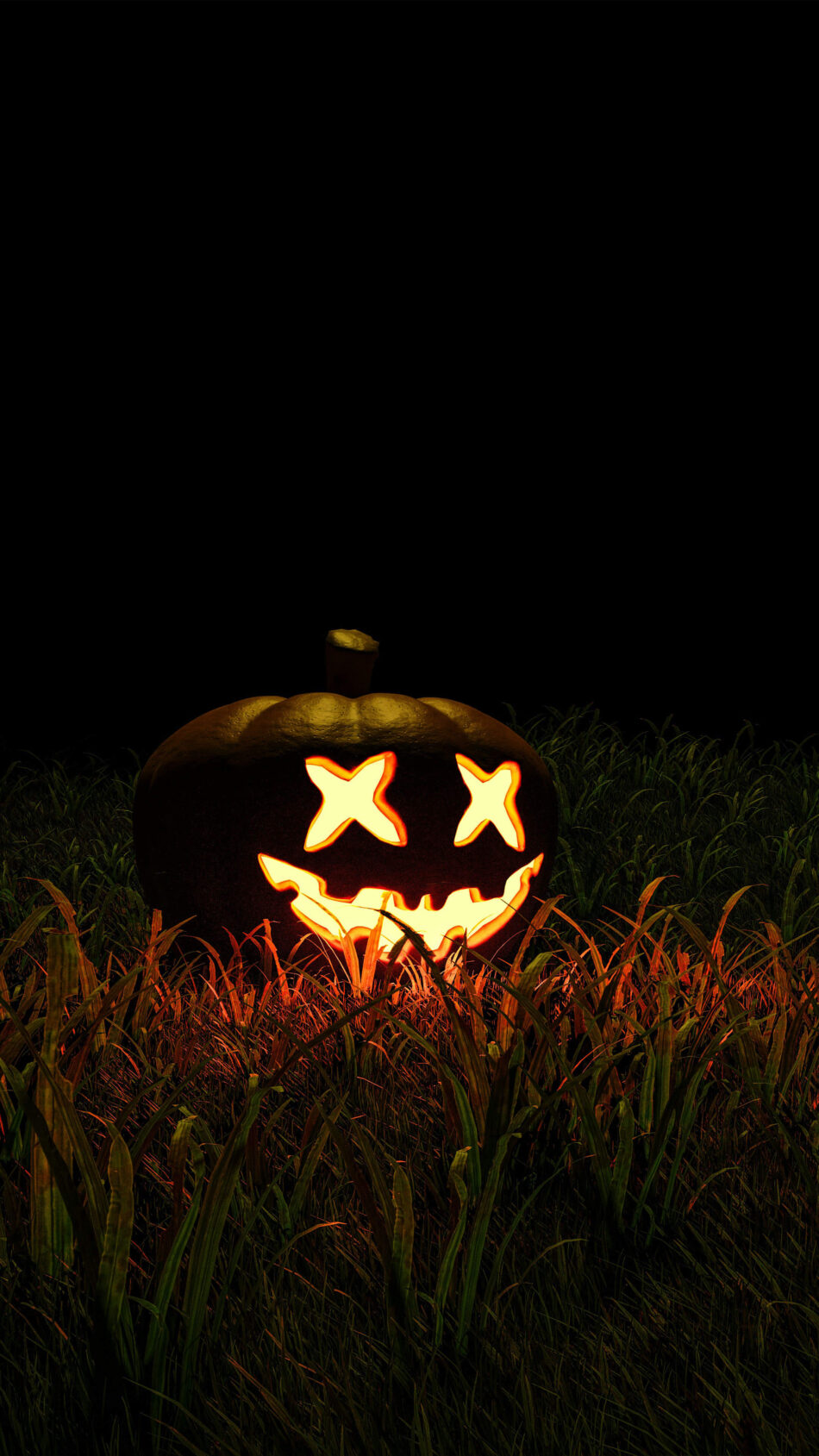 Glowing Halloween Pumpkin Decoration On Grass 4K Ultra HD Mobile Phone Wallpaper