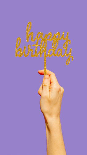 Hand Holding Happy Birthday Purple Background 4K Ultra HD Mobile Wallpaper