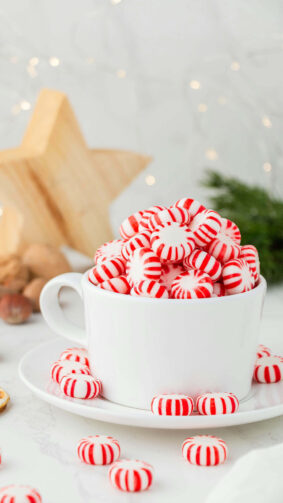 Cup Full of Red White Christmas Candies 4K Ultra HD Mobile Phone Wallpaper